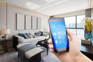 a hand holding a phone in a living room