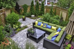 a patio area with a couch and table