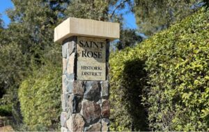 a stone sign post with a stone base